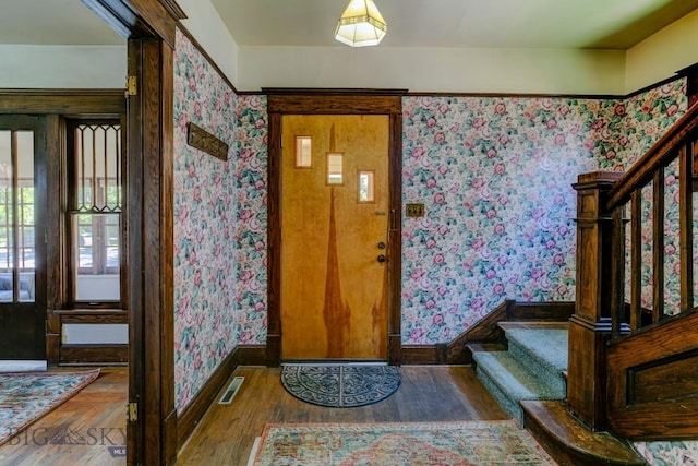 511 W Babcock, Bozeman, MT 59715 - entryway with wallpapered walls, stairs, and wood finished floors