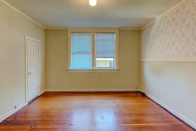 511 W Babcock, Bozeman, MT 59715 - spare room featuring wood finished floors, crown molding, and wainscoting