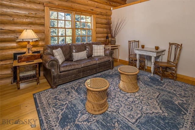 49824 Gallatin Rd, Big Sky, MT 59730 - living area with log walls and hardwood / wood-style flooring