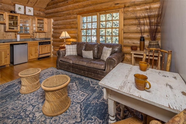 49824 Gallatin Rd, Big Sky, MT 59730 - living room with rustic walls, light wood-style flooring, lofted ceiling, and bar area