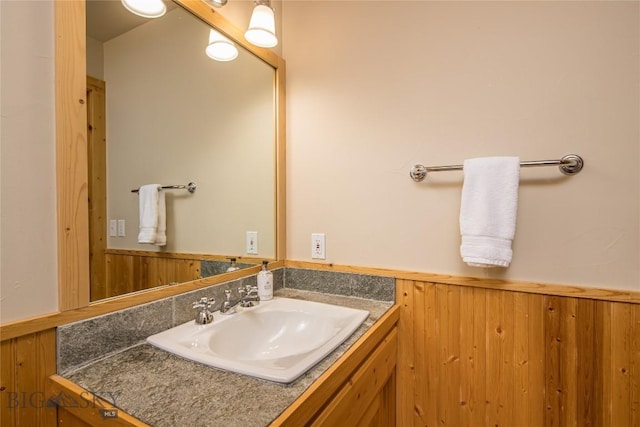 49824 Gallatin Rd, Big Sky, MT 59730 - bathroom with vanity, wainscoting, and wooden walls