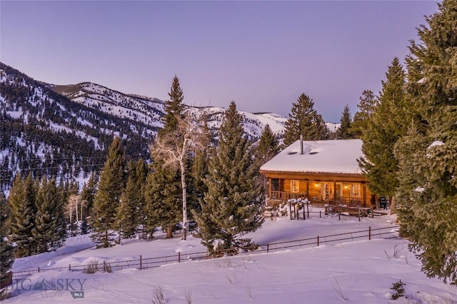49824 Gallatin Rd, Big Sky, MT 59730 - snow covered back of property featuring a mountain view