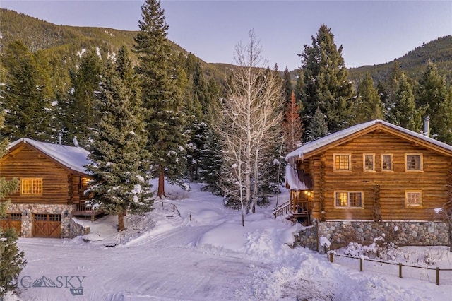 49824 Gallatin Rd, Big Sky, MT 59730 - view of mountain background featuring a heavily wooded area