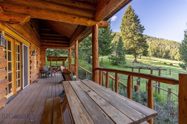 49824 Gallatin Rd, Big Sky, MT 59730 - deck featuring a view of trees