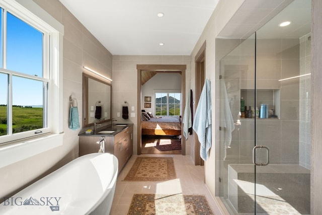 1878 Star Ridge Rd, Bozeman, MT 59715 - bathroom with vanity, a shower stall, connected bathroom, a soaking tub, and recessed lighting