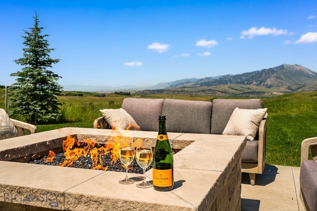 1878 Star Ridge Rd, Bozeman, MT 59715 - view of patio / terrace featuring a fire pit and a mountain view