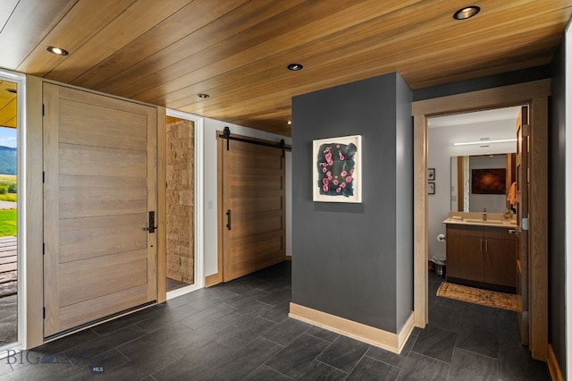 1878 Star Ridge Rd, Bozeman, MT 59715 - foyer entrance featuring a barn door, recessed lighting, and wood ceiling