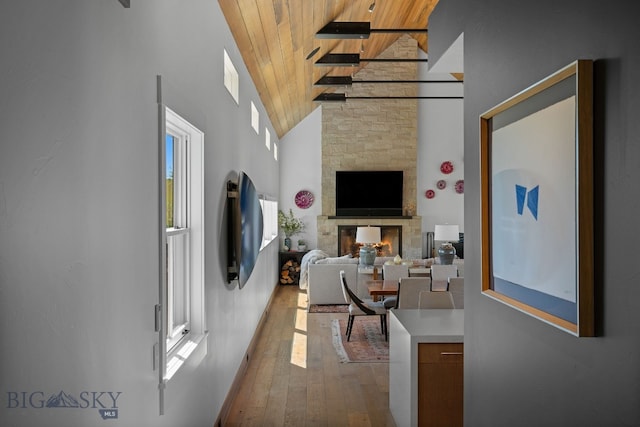 1878 Star Ridge Rd, Bozeman, MT 59715 - living room with wood ceiling, hardwood / wood-style flooring, a fireplace, and high vaulted ceiling