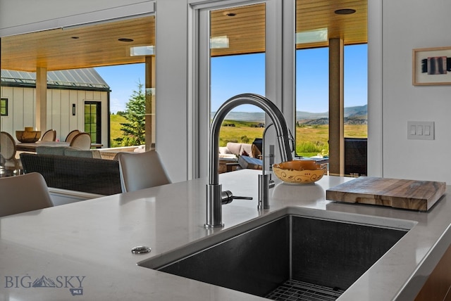 1878 Star Ridge Rd, Bozeman, MT 59715 - kitchen view of a sink and a mountain backdrop