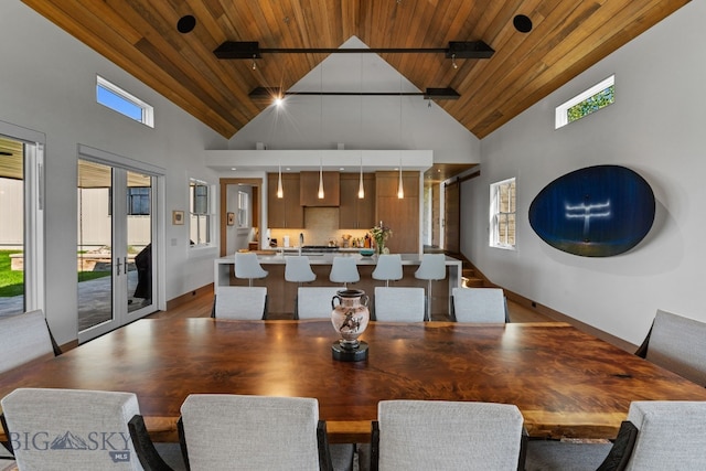 1878 Star Ridge Rd, Bozeman, MT 59715 - dining space featuring wood ceiling, high vaulted ceiling, and plenty of natural light