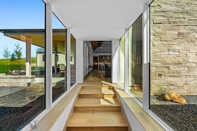 1878 Star Ridge Rd, Bozeman, MT 59715 - unfurnished sunroom featuring a wall of windows and wood finished floors