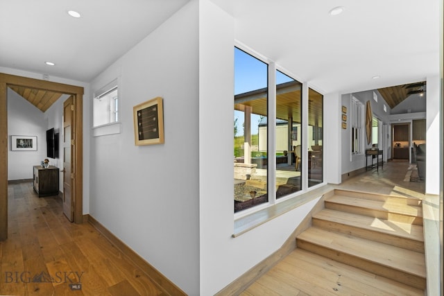 1878 Star Ridge Rd, Bozeman, MT 59715 - hall featuring vaulted ceiling, plenty of natural light, wood-type flooring, and recessed lighting