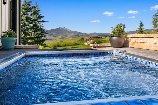 1878 Star Ridge Rd, Bozeman, MT 59715 - view of pool featuring a hot tub, a mountain view, and a swimming pool