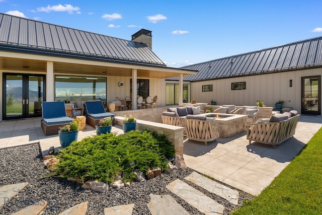 1878 Star Ridge Rd, Bozeman, MT 59715 - view of patio featuring french doors and an outdoor living space with a fire pit