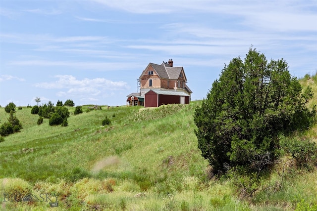 5835 Spaulding Bridge Rd, Belgrade, MT 59714 - view of yard featuring a barn, an outbuilding, and a view of countryside