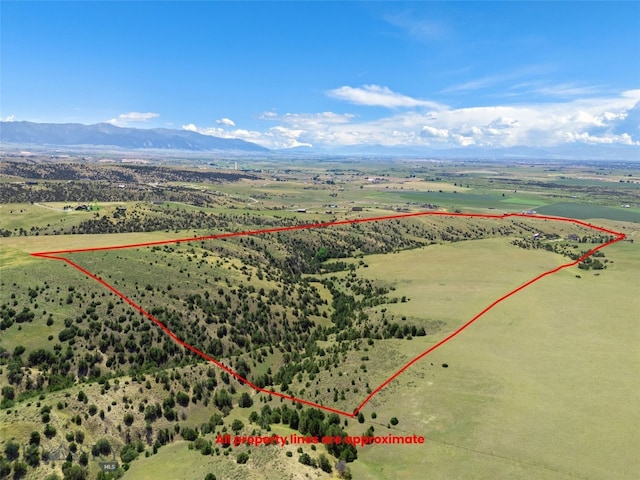 5835 Spaulding Bridge Rd, Belgrade, MT 59714 - aerial view of sparsely populated area with property boundaries highlighted and a mountainous background