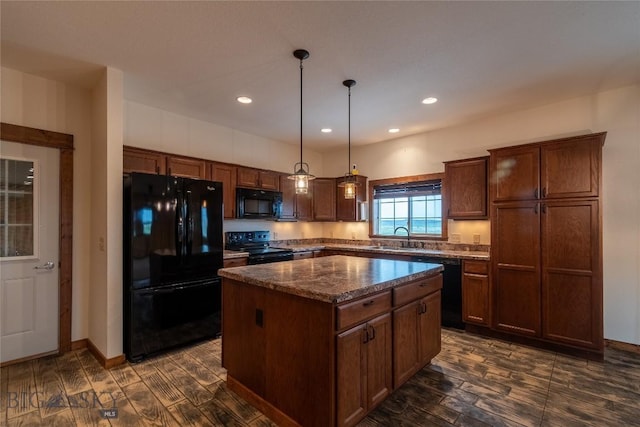 115 Otter Creek Rd, Big Timber, MT 59011 - kitchen with black appliances, dark wood-style floors, a kitchen island, hanging light fixtures, and recessed lighting