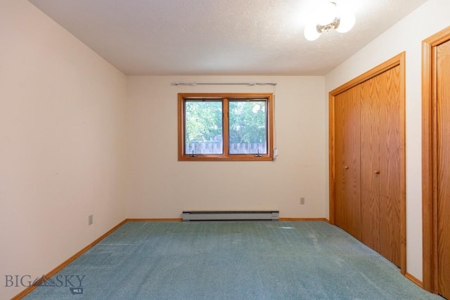 2200 W Dickerson Unit 46, Bozeman, MT 59718 - unfurnished bedroom with baseboard heating and carpet