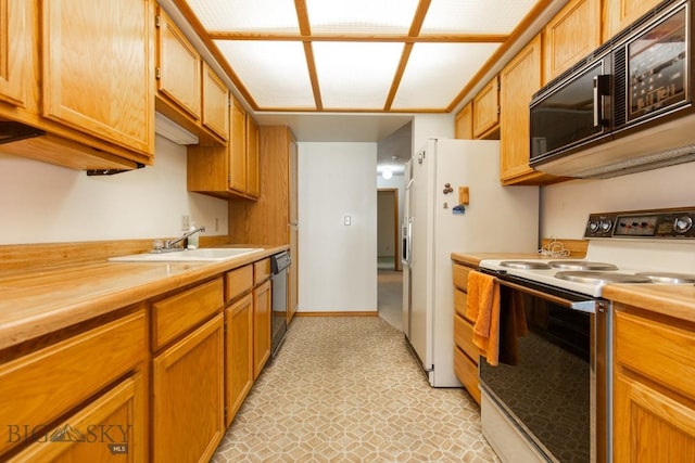 2200 W Dickerson Unit 46, Bozeman, MT 59718 - kitchen featuring white appliances, butcher block countertops, brown cabinetry, and light flooring