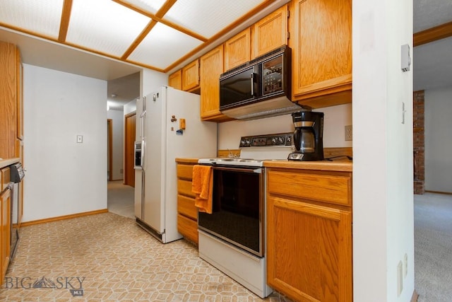 2200 W Dickerson Unit 46, Bozeman, MT 59718 - kitchen with white appliances and light countertops