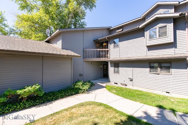 2200 W Dickerson Unit 46, Bozeman, MT 59718 - doorway to property with a balcony, crawl space, and a lawn
