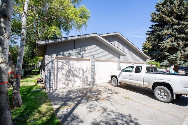 2200 W Dickerson Unit 46, Bozeman, MT 59718 - view of side of property with an attached garage and driveway