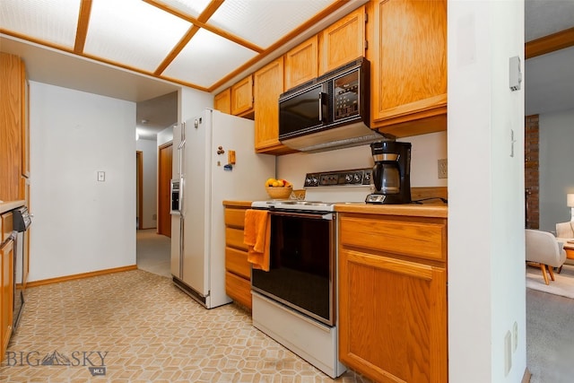 2200 W Dickerson Unit 46, Bozeman, MT 59718 - kitchen featuring white appliances and light countertops