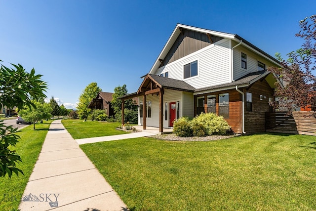 3139 Blackbird Dr, Bozeman, MT 59718 - view of front of house with a front lawn and board and batten siding