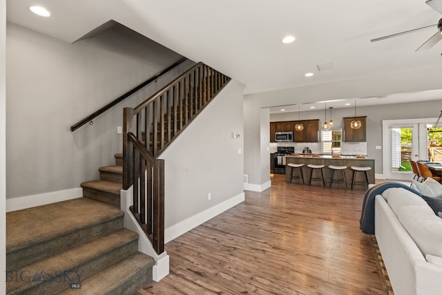 3139 Blackbird Dr, Bozeman, MT 59718 - living area featuring a ceiling fan, dark wood-style floors, recessed lighting, and stairs