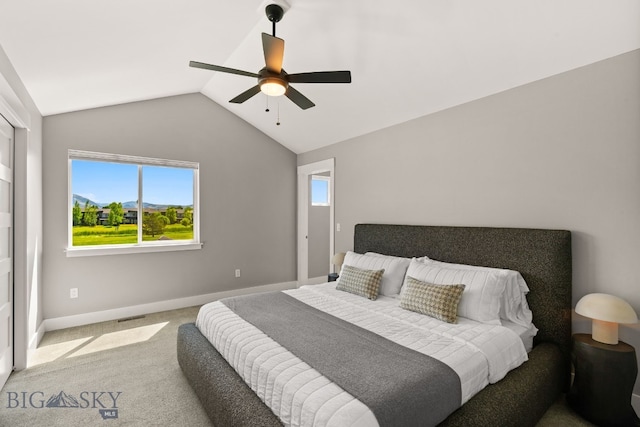 3139 Blackbird Dr, Bozeman, MT 59718 - carpeted bedroom featuring lofted ceiling, multiple windows, and a ceiling fan