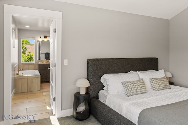 3139 Blackbird Dr, Bozeman, MT 59718 - bedroom with ensuite bath and recessed lighting