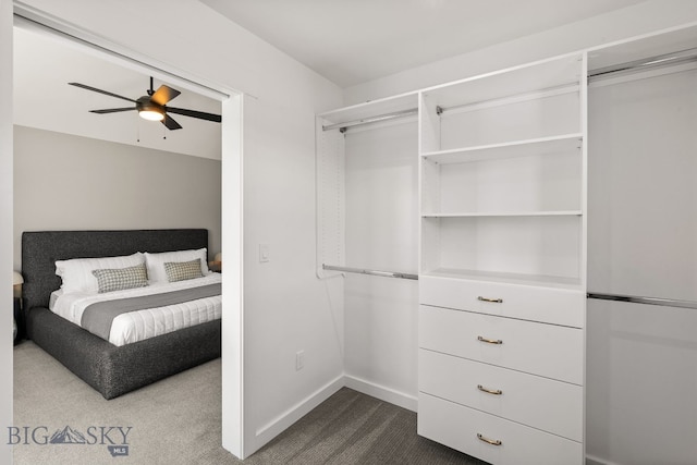 3139 Blackbird Dr, Bozeman, MT 59718 - unfurnished bedroom with refrigerator, dark carpet, and a ceiling fan