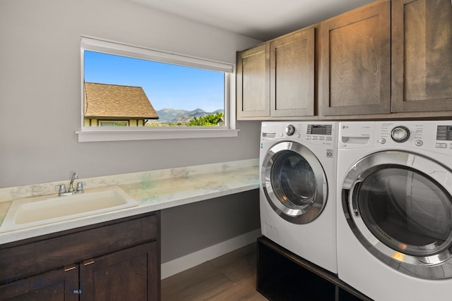 3139 Blackbird Dr, Bozeman, MT 59718 - washroom with cabinet space, separate washer and dryer, and dark wood-type flooring