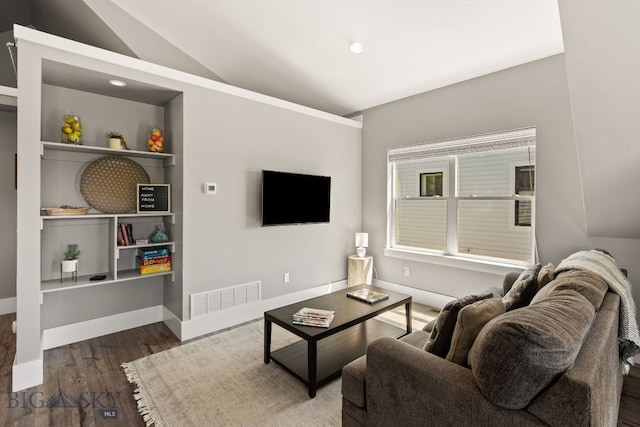 3139 Blackbird Dr, Bozeman, MT 59718 - living room featuring wood finished floors, vaulted ceiling, built in features, and recessed lighting