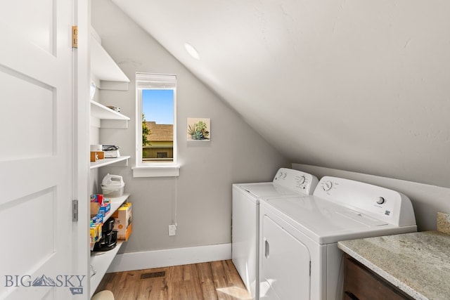 3139 Blackbird Dr, Bozeman, MT 59718 - washroom with light wood-style floors and washer and clothes dryer