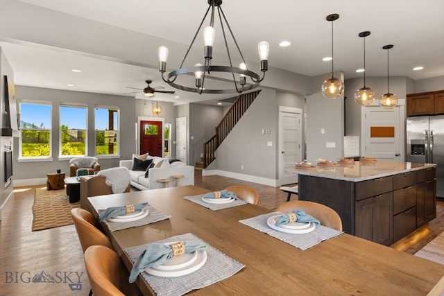 3139 Blackbird Dr, Bozeman, MT 59718 - dining room featuring a ceiling fan, wood finished floors, a chandelier, and recessed lighting