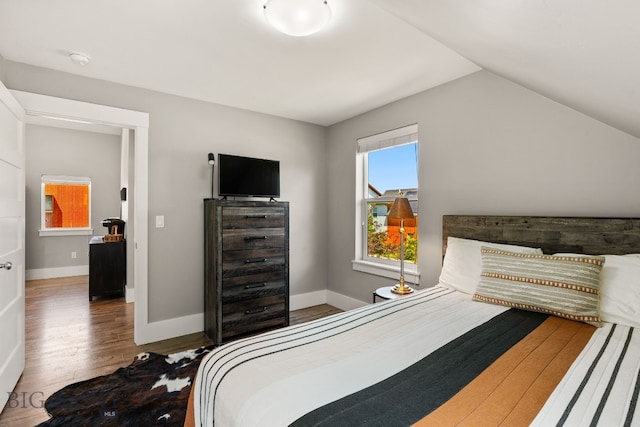3139 Blackbird Dr, Bozeman, MT 59718 - bedroom featuring wood finished floors and lofted ceiling