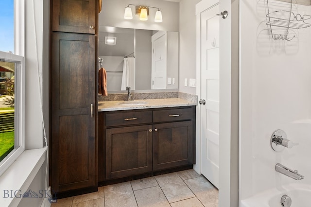 3139 Blackbird Dr, Bozeman, MT 59718 - bathroom featuring vanity, shower / bathtub combination with curtain, and tile patterned flooring