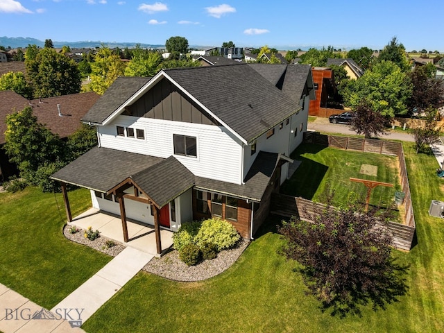 3139 Blackbird Dr, Bozeman, MT 59718 - view of front of house featuring board and batten siding, roof with shingles, an attached garage, and driveway