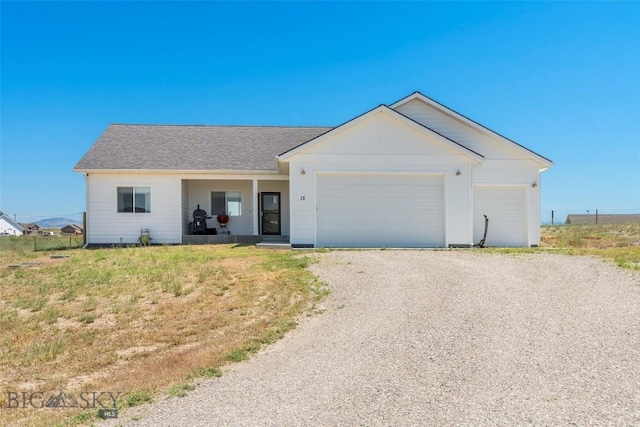 15 Santa Fe Trl, Three Forks, MT 59752 - ranch-style house featuring driveway, an attached garage, and roof with shingles