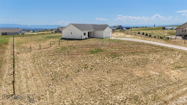 15 Santa Fe Trl, Three Forks, MT 59752 - view of yard featuring concrete driveway and a garage