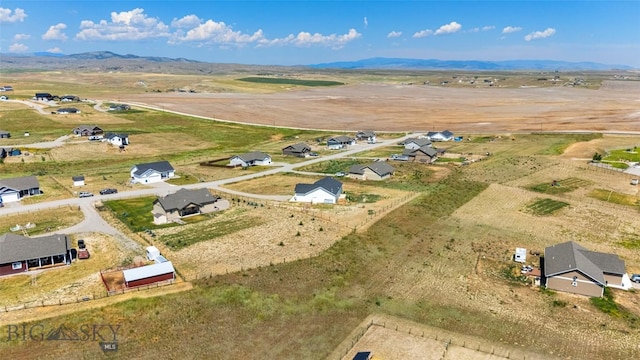 15 Santa Fe Trl, Three Forks, MT 59752 - aerial overview of property's location with rural landscape and a mountain backdrop