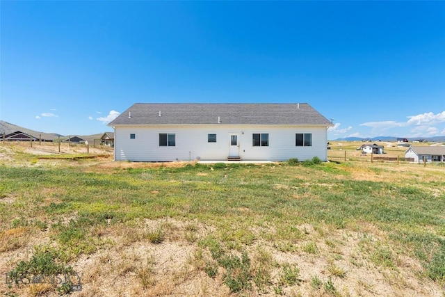15 Santa Fe Trl, Three Forks, MT 59752 - back of house featuring a lawn