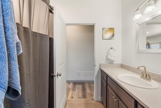 15 Santa Fe Trl, Three Forks, MT 59752 - full bathroom with wood finished floors, vanity, and a shower with curtain