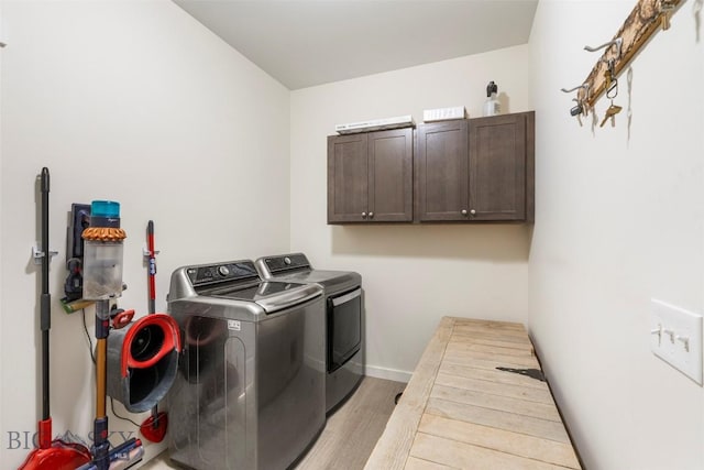 15 Santa Fe Trl, Three Forks, MT 59752 - laundry room featuring cabinet space, washing machine and clothes dryer, and light wood-style floors