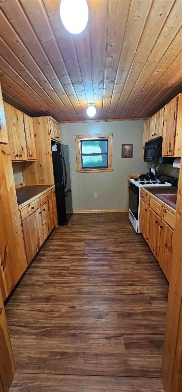 1105 S Boulder Rd, Cardwell, MT 59721 - kitchen featuring black appliances, wood ceiling, dark wood-type flooring, and dark countertops