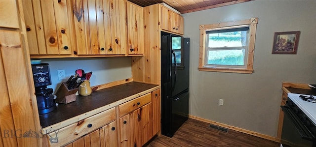 1105 S Boulder Rd, Cardwell, MT 59721 - kitchen with freestanding refrigerator, dark countertops, gas range oven, wood ceiling, and dark wood finished floors