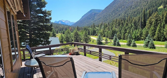 1105 S Boulder Rd, Cardwell, MT 59721 - wooden terrace featuring a view of trees and a mountain view