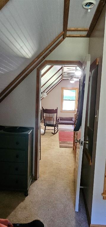 1105 S Boulder Rd, Cardwell, MT 59721 - unfurnished bedroom featuring vaulted ceiling and light colored carpet