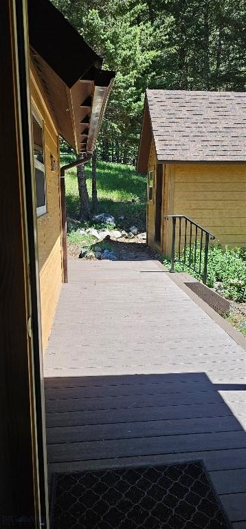 1105 S Boulder Rd, Cardwell, MT 59721 - wooden terrace featuring a storage unit